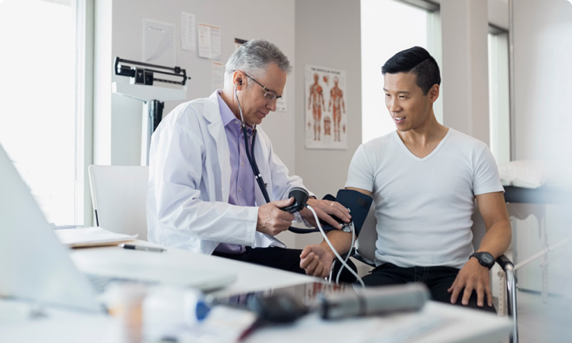 Woman doctor wearing lab coat with stethoscope isolated