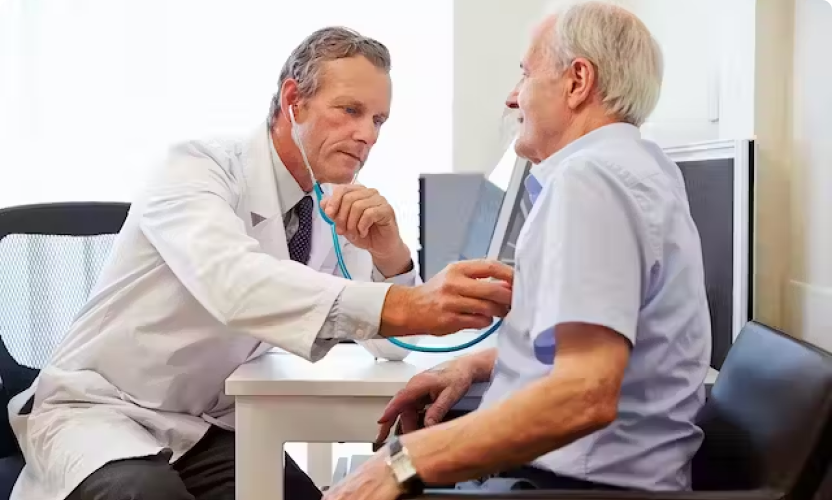 Woman doctor wearing lab coat with stethoscope isolated